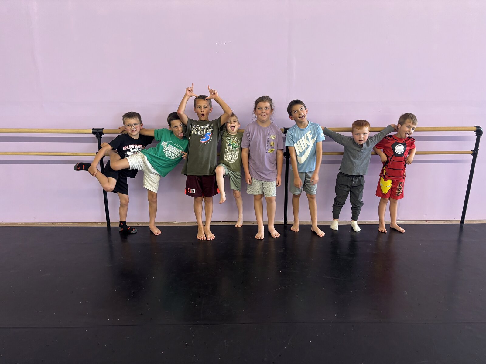Dancers goofing around at the barre at Thrive Dance Company