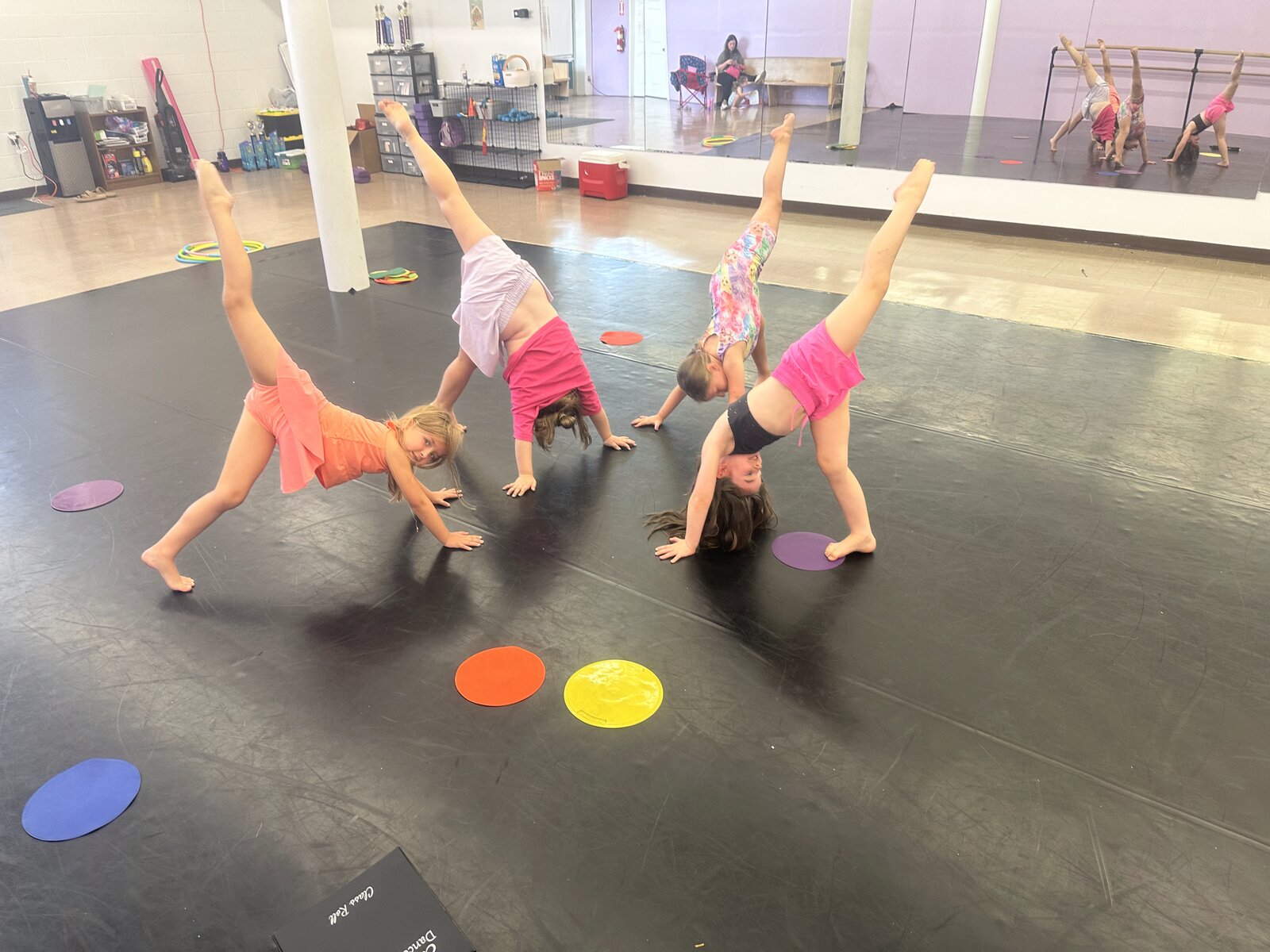 Dancers practicing cartwheels at Thrive Dance Company