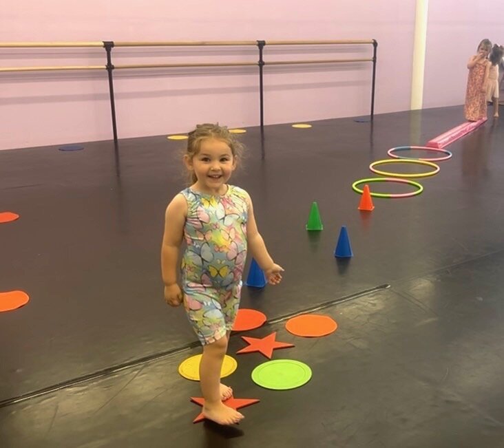 Preschool dancer on an obstacle course at Thrive Dance Company